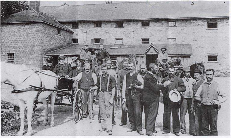 Henry Calcutt with workers at brewery